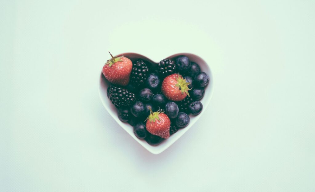 Heart shaped bowl filled with fruit