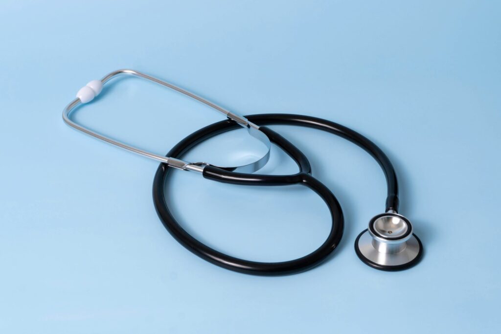 Black stethoscope with blue backdrop