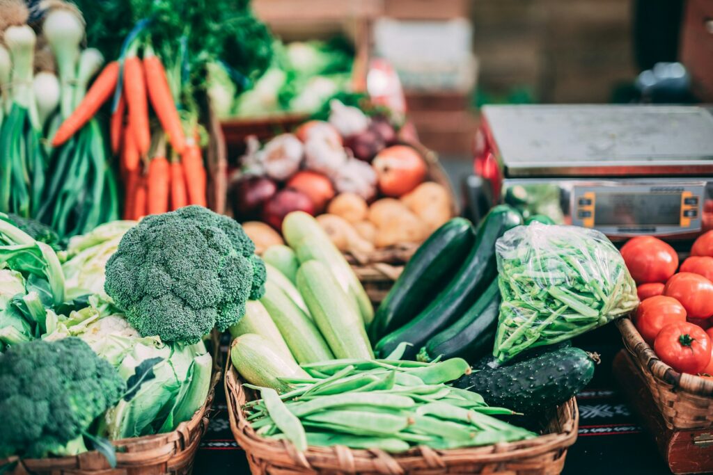 Assortment of vegetables at a stand at a farmers' market.